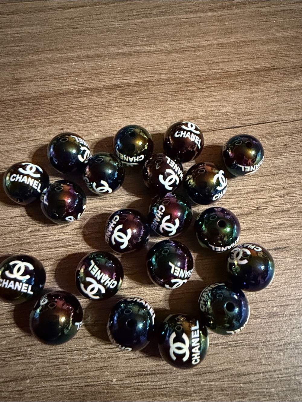 20 pieces of CC Iridescent Logo Beads 16 mm in Black with Green and Purple Sheen